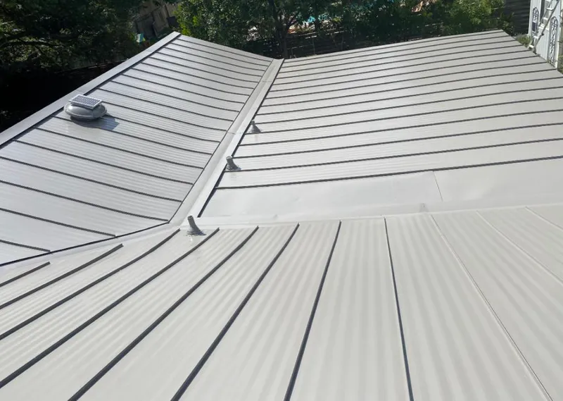 Solar attic fan installed on a metal roof for Roof Ventilation in Neenah